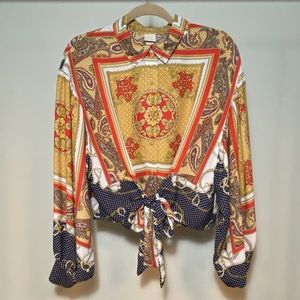 H&M Patterned button up tie front blouse.